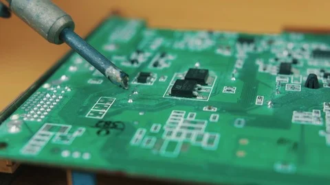 The man solders a chip Stock Footage 70599903