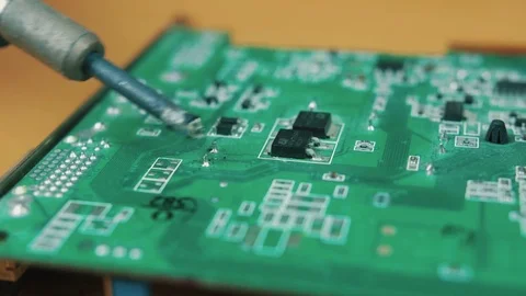 The man solders a chip Stock Footage 70600239