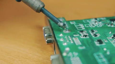 The man solders a chip Stock Footage 70600366