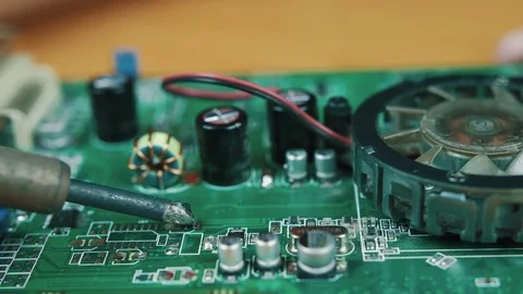 The man solders a chip Stock Footage 70601793