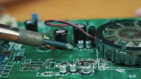 The man solders a chip Stock Footage 70601955