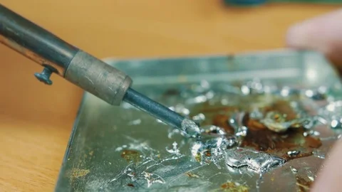 The man solders a chip Stock Footage 70602008