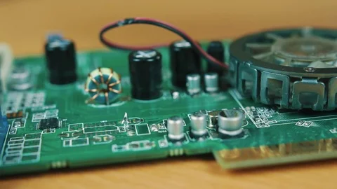 The man solders a chip Stock Footage 70602455