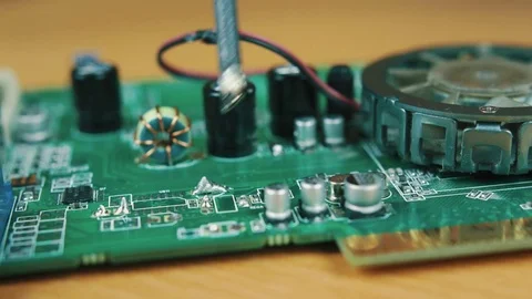 The man solders a chip Stock Footage 70602564
