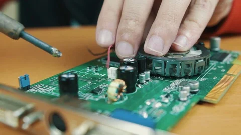 The man solders a chip Stock Footage 70602702