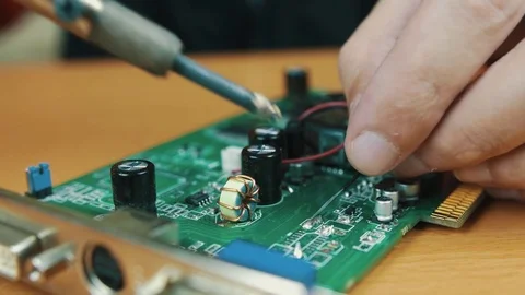 The man solders a chip Stock Footage 70603014