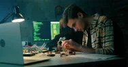 Man Solders In Electronics Workshop. Hacking Attack Or It Startup Concept Stock Footage