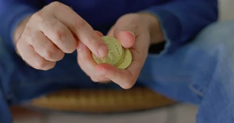 Man with some bitcoins in his hands in closeup Stock Footage 238768503