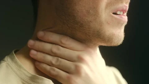 Man with sore throat massaging neck Stock Footage 337828081