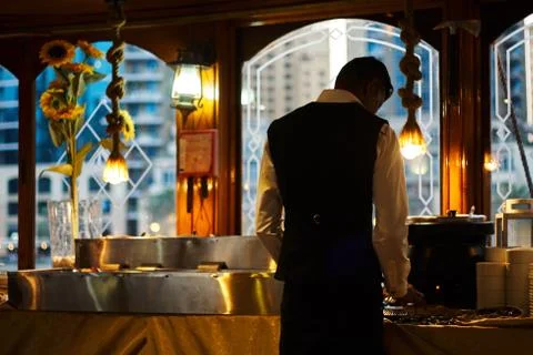 A man sorting food inside the ship Stock Photos
