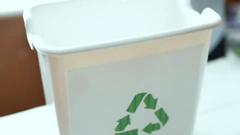 Man sorting plastic bottles and paper waste into recycling bins at home kitchen, 스톡 동영상 330883550