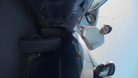 A man is sorting through documents after a car accident. Stock Footage 278190935