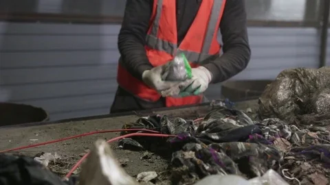 Man sorts garbage on the conveyor Stock Footage 82054227
