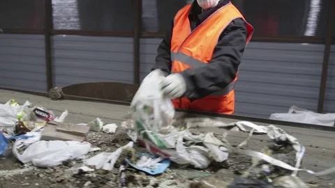 Man sorts garbage on the conveyor Stock Footage 82054238