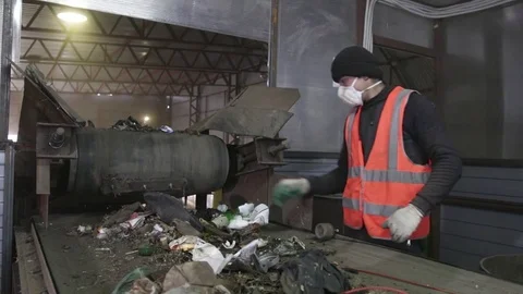 Man sorts garbage on the conveyor Stock Footage 82054395