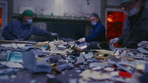 Man sorts garbage, electronics or plastic. Waste recycling plant or garbage Video stock 273033878