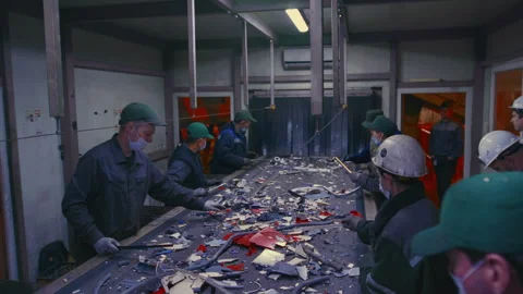 Man sorts garbage, electronics or plastic. Waste recycling plant or garbage Video stock 307641088