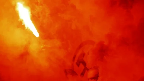 A man with a sparkler in the stadium stand. During a football match Video stock 118640871