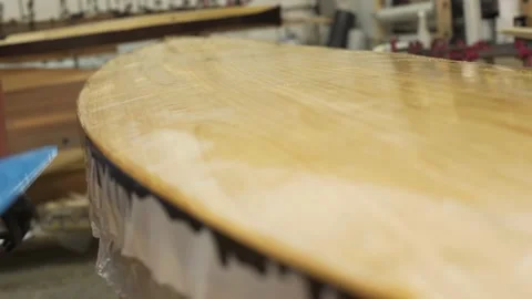 Man with a spatula spread the resin on CERF Horde Stock Footage 134903845