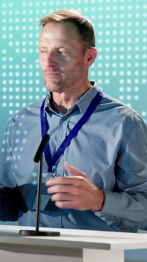 Man, speaker and award on podium at seminar, nomination and thank you speech for Stock Footage 343733401