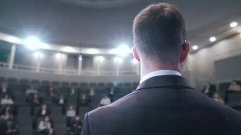 A man speaking to an audience at a conference Stock Footage 150230301