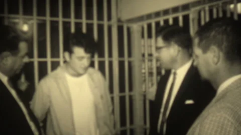 Man speaking to detective inside jail ce... | Stock Video | Pond5