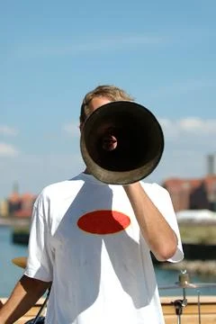 Man speaking in a megaphone Stock Photos