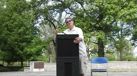 Man speaking at a Podium Video stock 55180100