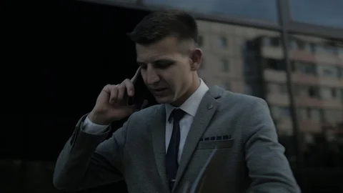 The man speaks distractingly on the phone Stock Footage 113471419