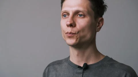 The man speaks into a lavalier microphone. Checking the sound Stock Footage 311570223