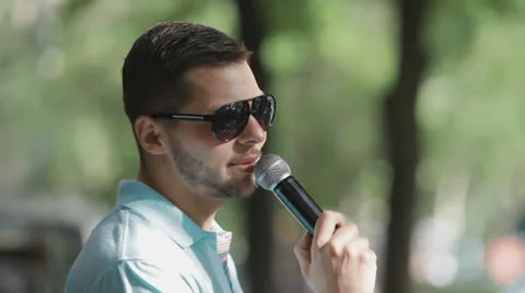 Man speaks into a microphone Stock Footage 23890285