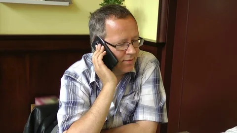 Man speaks by phone Stock Footage 85234797