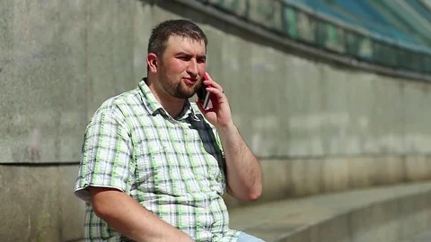 Man speaks on smartphone Stock Footage 81413489