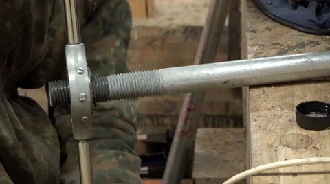 Man in special clothes and gloves by a special tool performs lubrication and Stock Footage 62008341