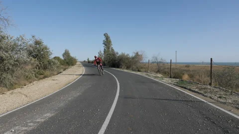 Man in special protective clothes rides modern bike fast Stock Footage 145323286
