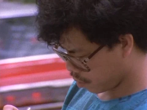 Man in spectacles filling the visa form precisely Stock Footage 79878296