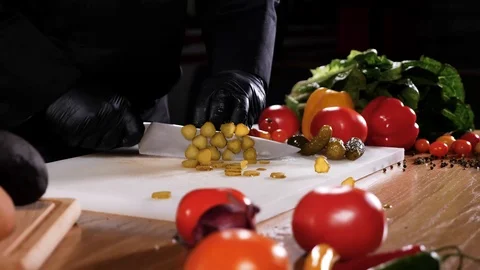 Man spectacularly cut cucumbers on a table. Stock Footage 94217363