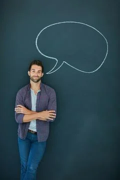 Man, speech bubble and arms crossed in portrait, chalkboard and smile with .. Stock Photos