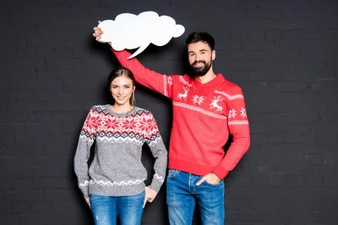 Man with speech bubble over girlfriend's head Stock Photos
