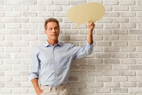 Man with speech bubbles Stock Photos