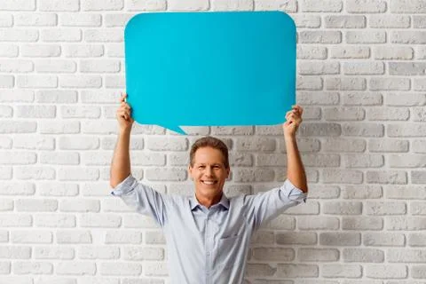 Man with speech bubbles Stock Photos