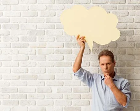 Man with speech bubbles Stock Photos