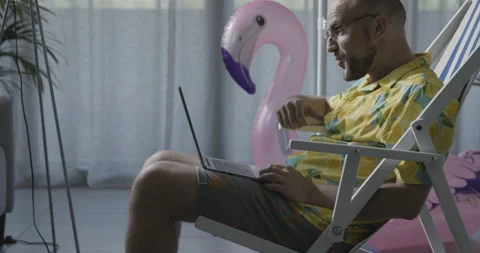 Man spending vacations at home and videocalling Stock Footage 162390384