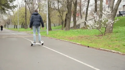 Man is spinning on a hover board. Stock Footage 74498006