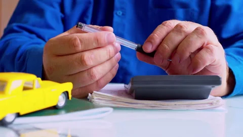 Man spinning pen while brainstorming strategy at office desk. Stock Footage 337671223