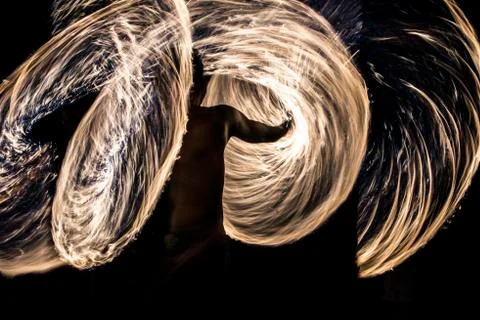 Man spinning wire wool during night 스톡 사진