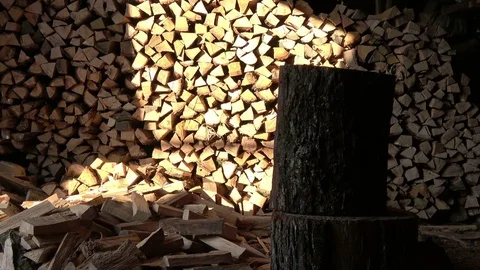 A man split oak log by the axe Stock Footage 72287269