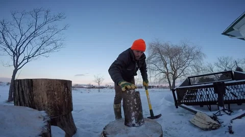 Man splits wood fisheye view Stock Footage 59081756