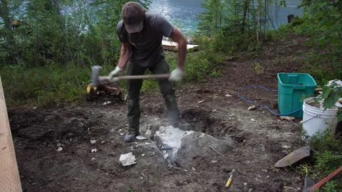 Man Splitting Rock With Sledge Hammer Stock Footage 250294533