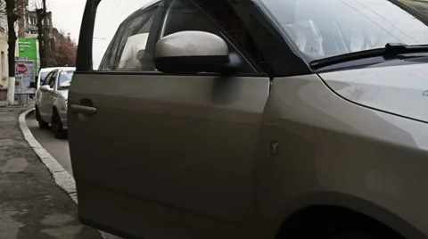 Man in sport jacket gets out of the car Stock Footage 58180123